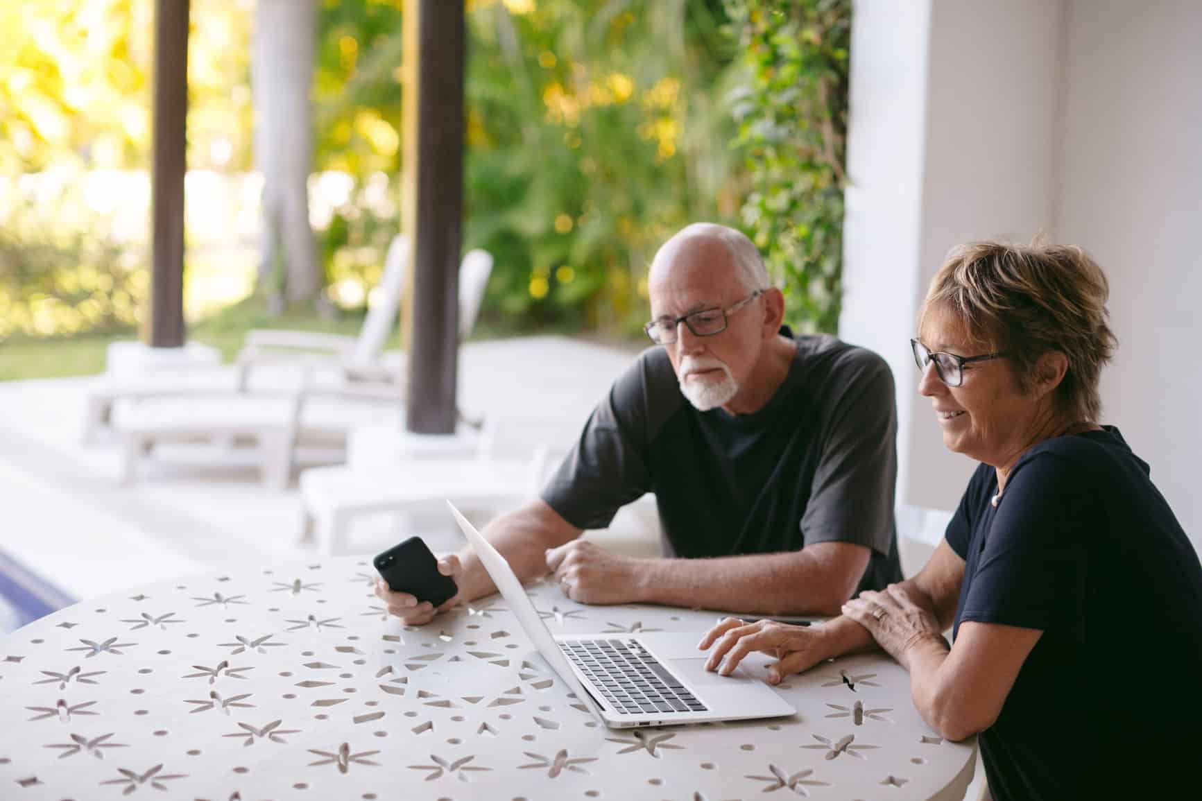 Couple Using Technology At Home
