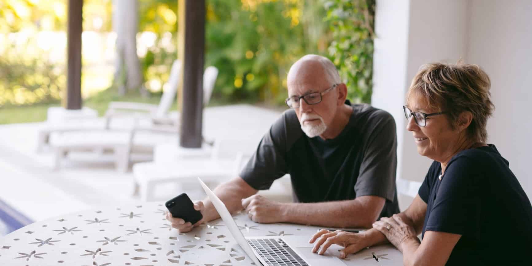 Couple Using Technology At Home